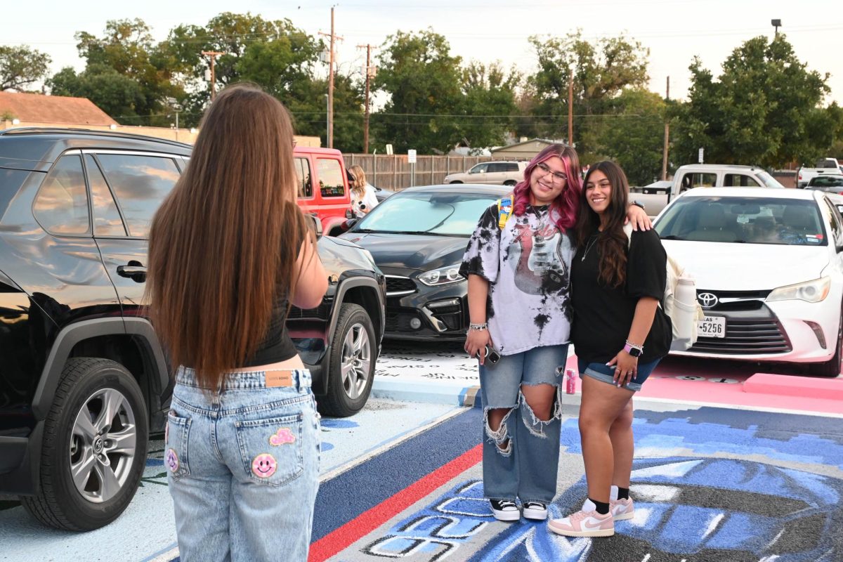 Seniors taking pictures in their spots
